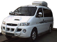 Hyundai H200, H1, Starex 1998–2007 Středový lip nárazníku s otvory pro mlhovky (k lakování) fotografie 1