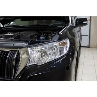 Mračítko na světlomet (strana řidiče, pro reflektorové světlomety) Toyota Land Cruiser Prado 150 2009–2023 fotografie 1