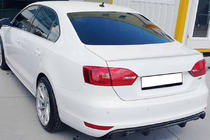 Volkswagen Jetta 2011–2018 OEM spoiler (k lakování) fotografie 1