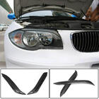 BMW řada 1 E81/E82/E87/E88 2004–2011 Mračítka na světlomety (karbon) fotografie 1