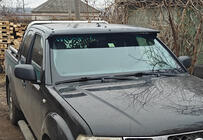 Nissan Navara 2006–2015 Sluneční clona na čelní sklo (na rámu) fotografie 1