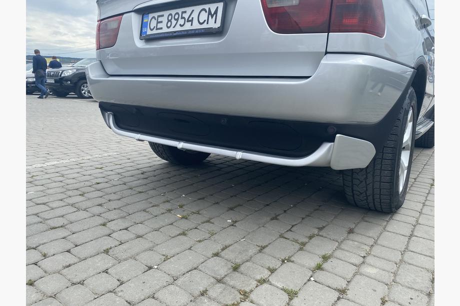 BMW X5 E53 1999–2006 Nástavec zadního nárazníku (k lakování) Fotografie 1