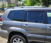 Toyota Land Cruiser Prado 120 2002–2009 Turecké chromované střešní ližiny Plastové patky fotografie 1