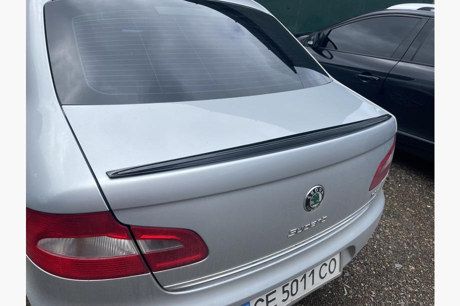 Skoda Superb 2009–2015 LIP spoiler (Sunplex, černý) (115,8 cm × 6,3 cm) Image
